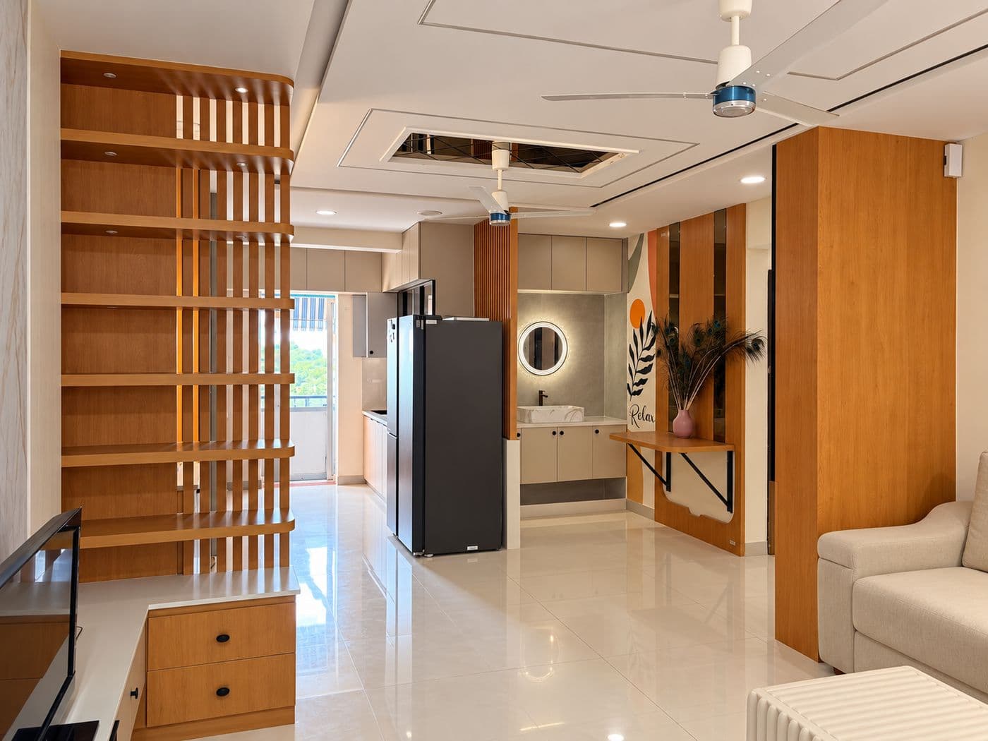 Living area with a timber slat partition, shelving and a false ceiling